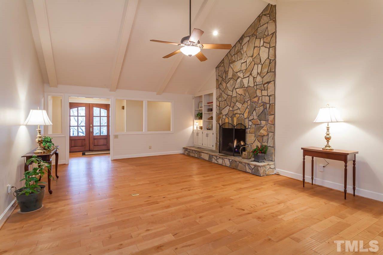 6909 Valley Ridge Court Raleigh, NC 27615 - Photo 5 of 25 a view of a livingroom with a fireplace and window