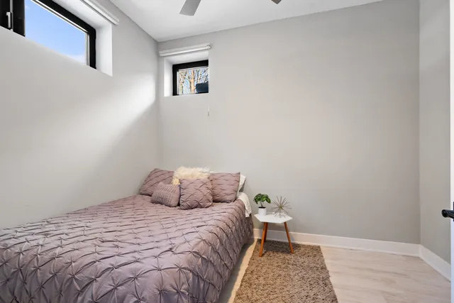 a bedroom with a bed and a table