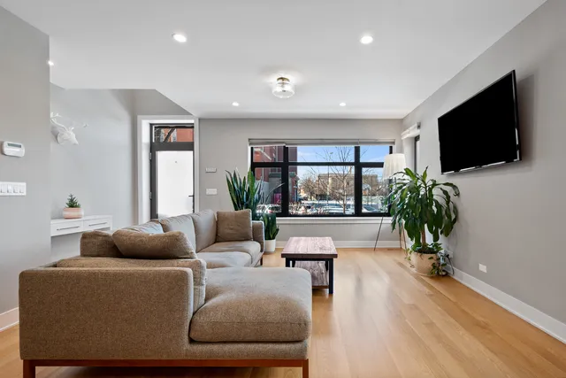 a living room with furniture fireplace and a flat screen tv