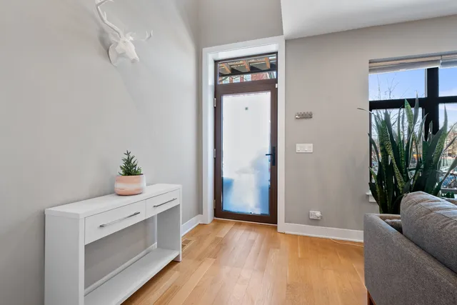 a view of room with hardwood floor and hallway