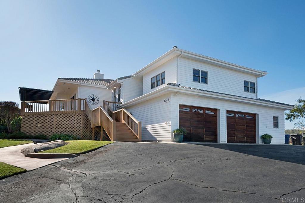 3743 Via Cielo Azul Alpine, CA 91901 - Photo 1 of 34 a front view of a house with a yard and garage