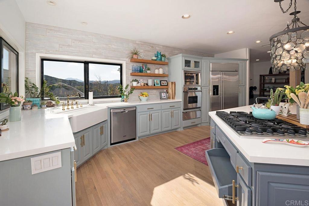 3743 Via Cielo Azul Alpine, CA 91901 - Photo 13 of 34 a kitchen with a sink stove and cabinets