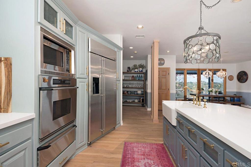 3743 Via Cielo Azul Alpine, CA 91901 - Photo 14 of 34 a kitchen with stainless steel appliances a sink and a refrigerator