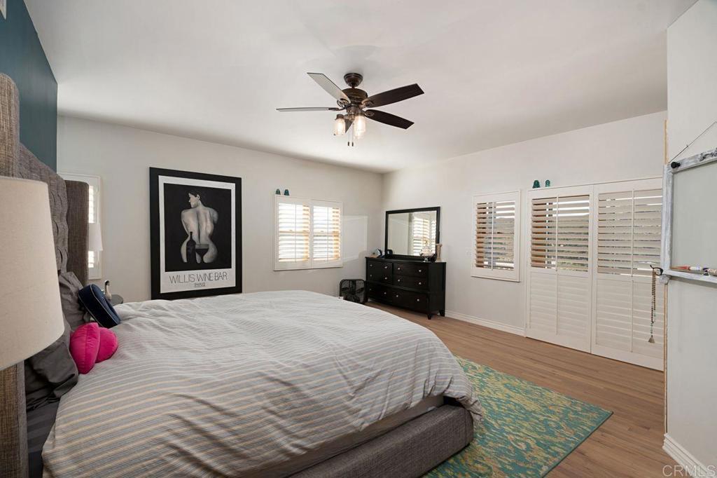 3743 Via Cielo Azul Alpine, CA 91901 - Photo 16 of 34 a bedroom with a large bed and a window