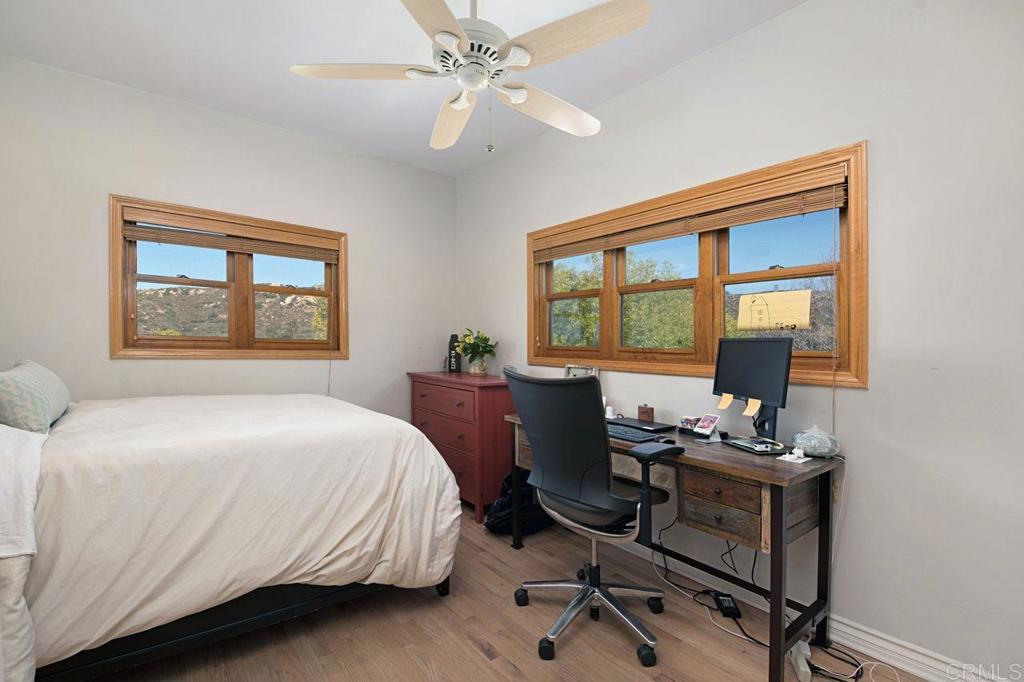 3743 Via Cielo Azul Alpine, CA 91901 - Photo 22 of 34 a bedroom with a bed and a window
