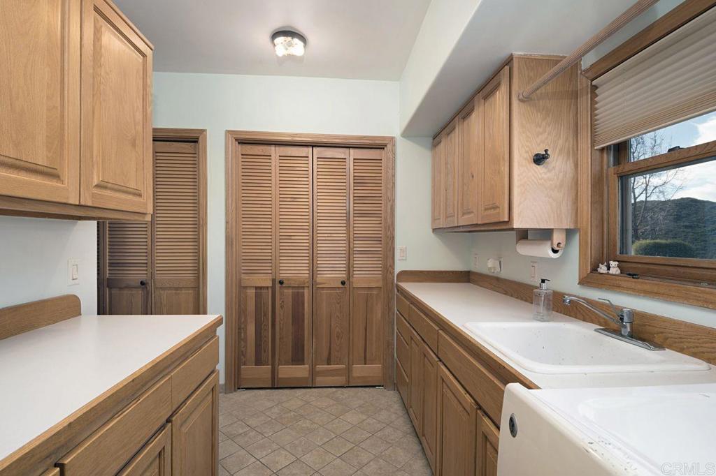 3743 Via Cielo Azul Alpine, CA 91901 - Photo 26 of 34 a kitchen with a sink stove and cabinets