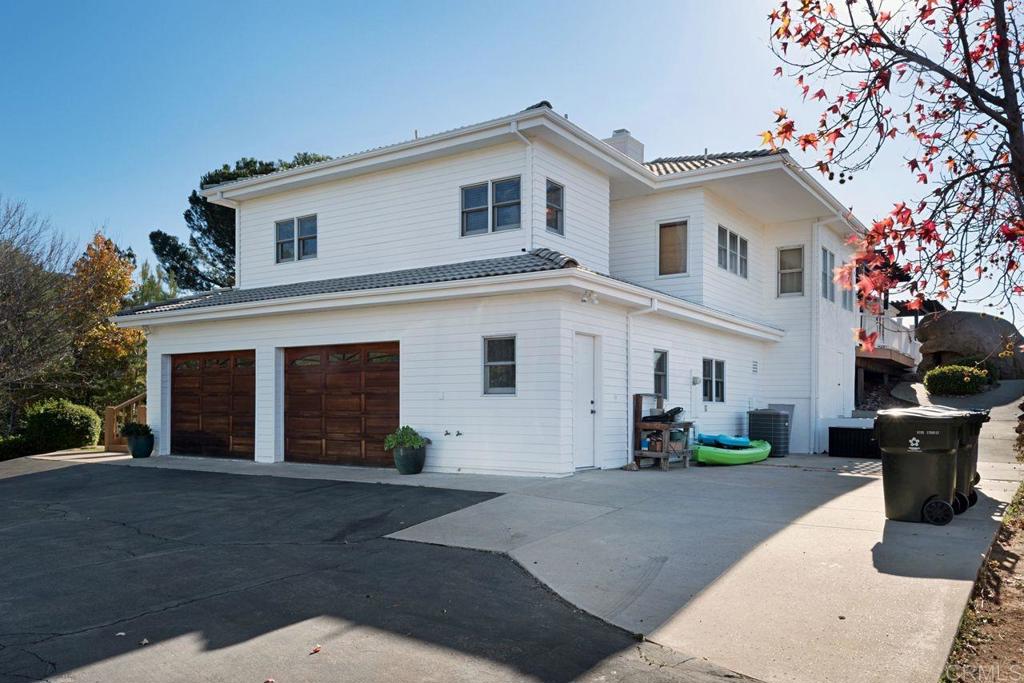 3743 Via Cielo Azul Alpine, CA 91901 - Photo 33 of 34 a front view of a house with a yard and garage