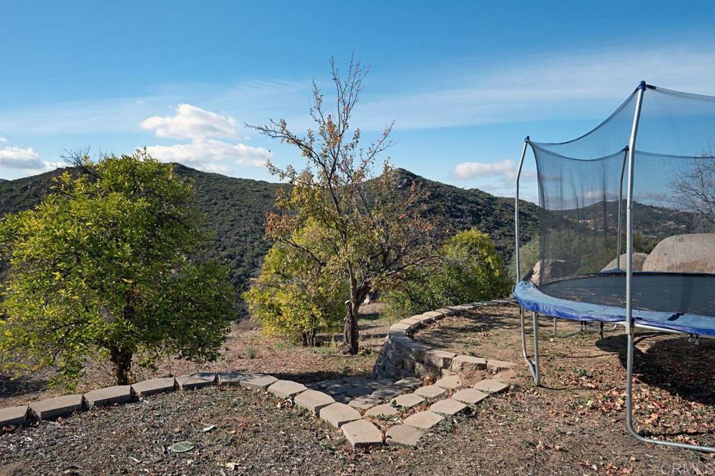 3743 Via Cielo Azul Alpine, CA 91901 - Photo 5 of 34 a backyard of a house with table and chairs