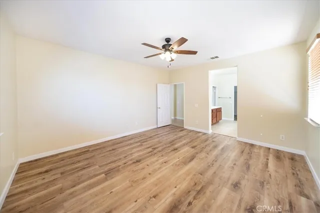 a spacious bathroom with a double vanity sink a mirror and a shower