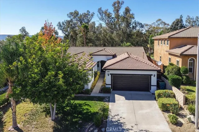 front view of a house with a garden
