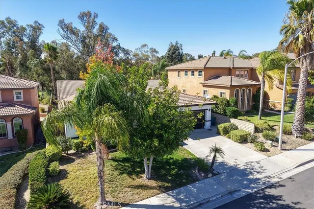 a view of a patio with table and chairs potted plants