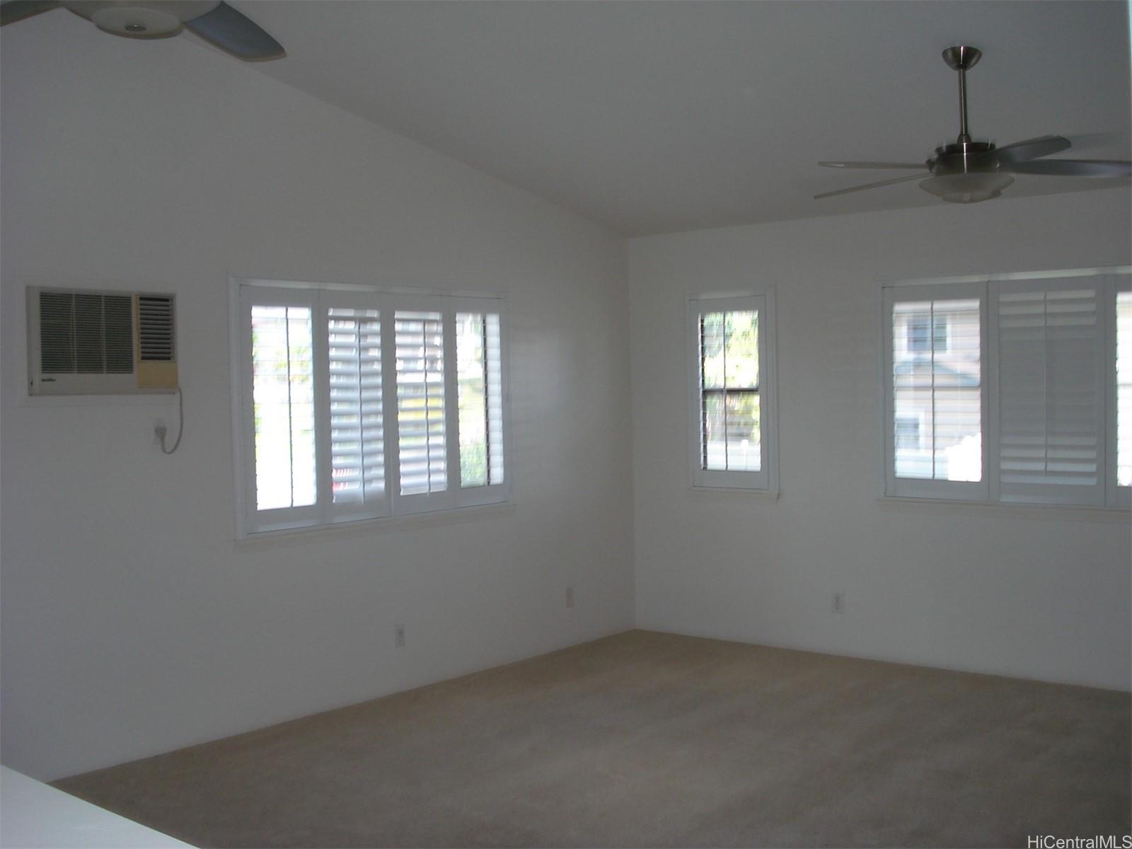 95-1007 Paepae Street, Unit 2 Mililani, HI 96789 - Photo 2 of 8 an empty room with windows