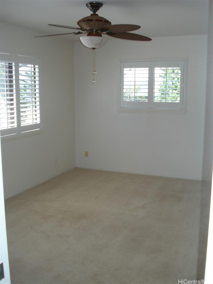 95-1007 Paepae Street, Unit 2 Mililani, HI 96789 - Photo 4 of 8 an empty room with windows