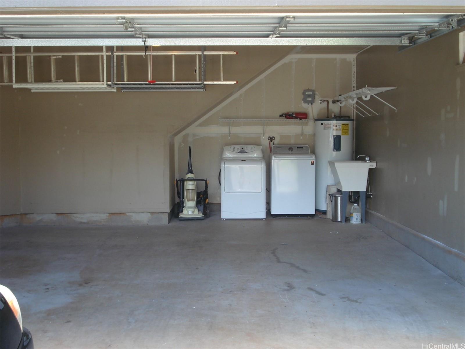 95-1007 Paepae Street, Unit 2 Mililani, HI 96789 - Photo 7 of 8 a view of a car garage