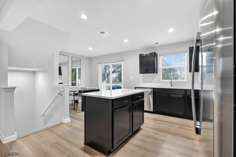 55 Limestone Boulevard Washington, NJ 07882 - Photo 12 of 25 a large kitchen with a counter top space a sink stainless steel appliances and cabinets