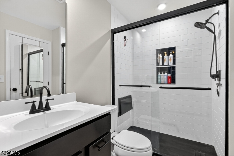 55 Limestone Boulevard Washington, NJ 07882 - Photo 15 of 25 a bathroom with a sink a toilet and shower