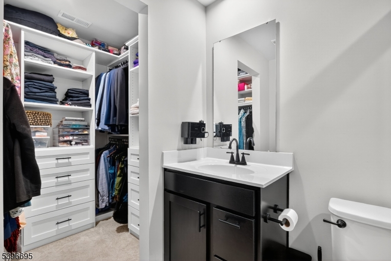 55 Limestone Boulevard Washington, NJ 07882 - Photo 17 of 25 a bathroom with a sink vanity and a mirror