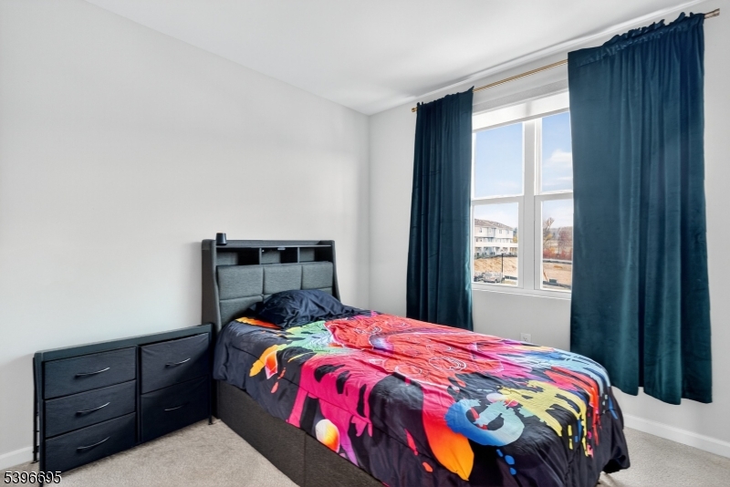 55 Limestone Boulevard Washington, NJ 07882 - Photo 18 of 24 a bedroom with a bed and a window