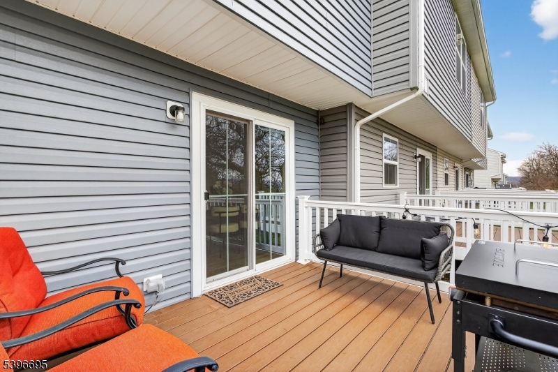 55 Limestone Boulevard Washington, NJ 07882 - Photo 22 of 24 a balcony with furniture and a wooden floor