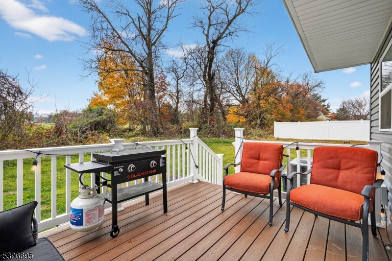 55 Limestone Boulevard Washington, NJ 07882 - Photo 22 of 25 a balcony with wooden floor and outdoor seating