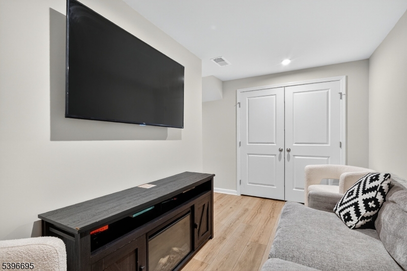 55 Limestone Boulevard Washington, NJ 07882 - Photo 6 of 25 a living room with furniture and a flat screen tv