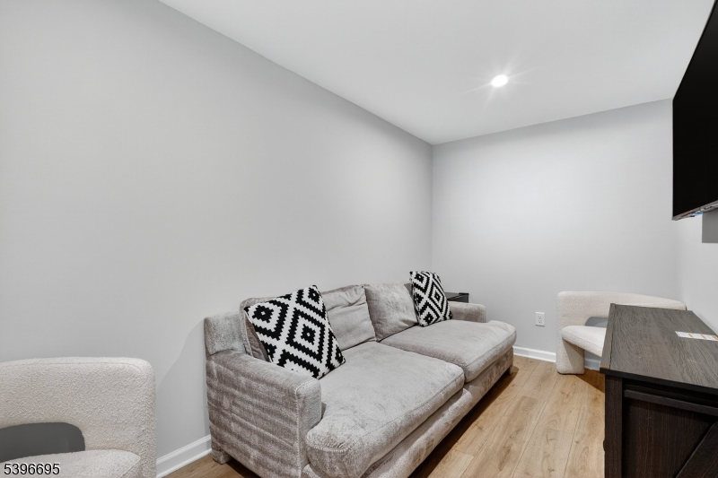 55 Limestone Boulevard Washington, NJ 07882 - Photo 7 of 25 a bedroom with a bed and a television