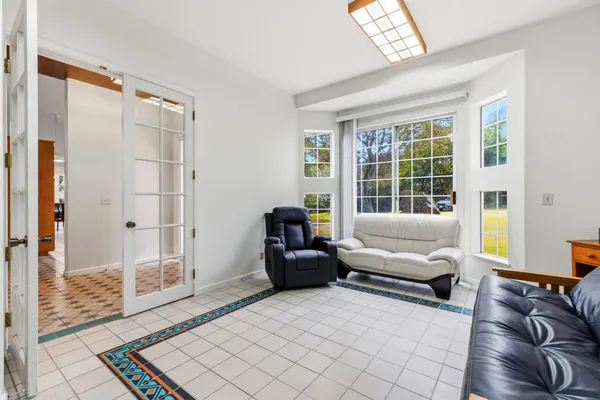 a living room with furniture and a large window