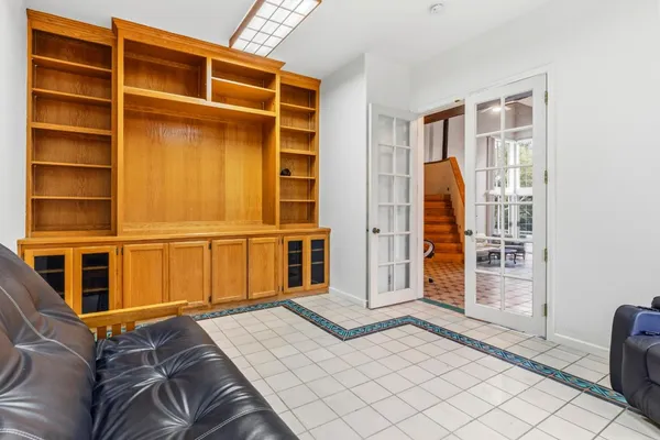 a bed room with a bed and a chair