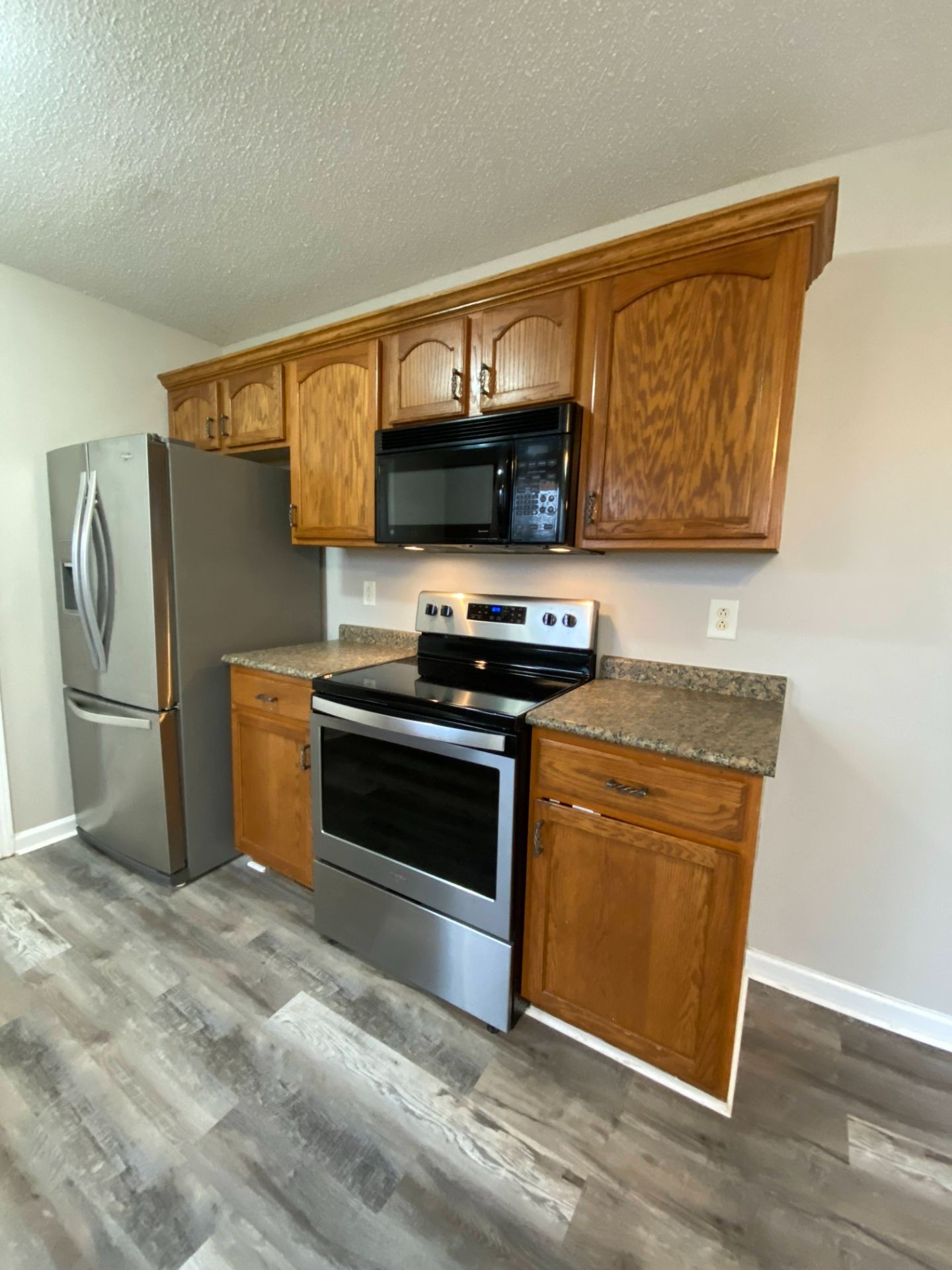 428 Filmore Road Oak Grove, KY 42262 - Photo 3 of 16 a kitchen with stainless steel appliances a stove microwave and a sink