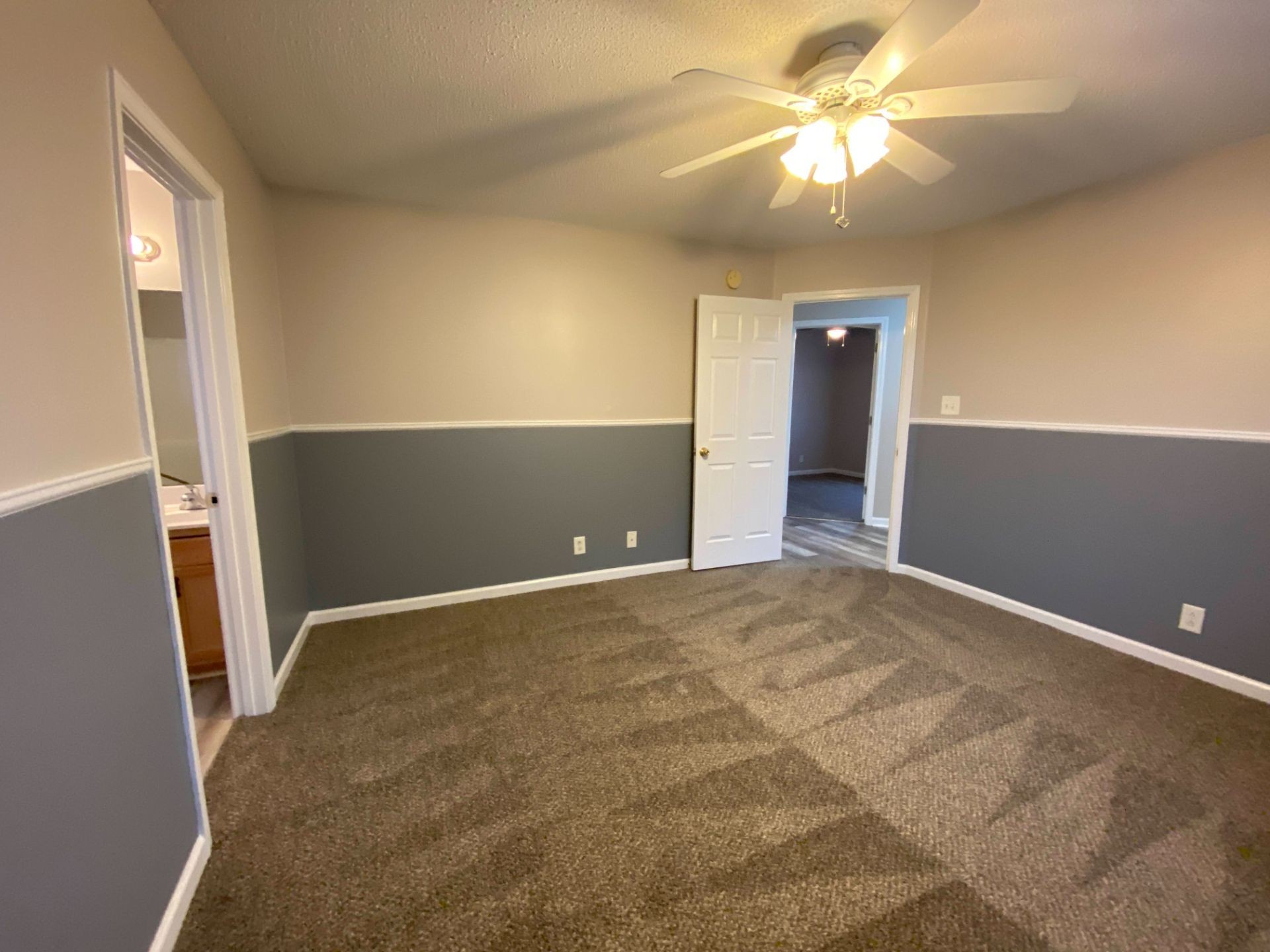 428 Filmore Road Oak Grove, KY 42262 - Photo 8 of 16 en empty room with closet and a chandelier fan
