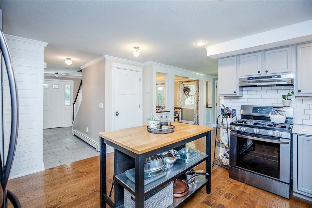 374 Adams Road Oakham, MA 01068 - Photo 12 of 36 a kitchen with a stove a sink and a refrigerator