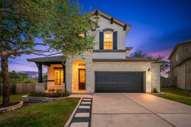a front view of a house with yard
