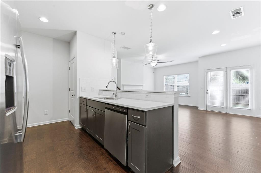 2717 Avanti Way Decatur, GA 30035 - Photo 2 of 15 a kitchen with a sink a refrigerator and window