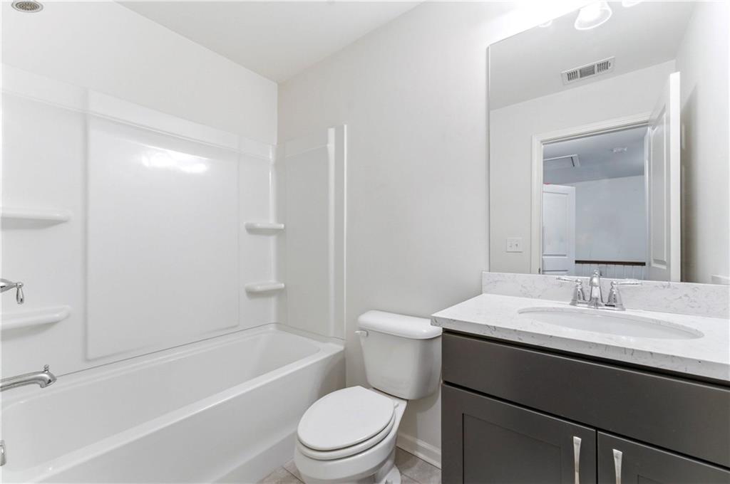 2717 Avanti Way Decatur, GA 30035 - Photo 9 of 15 a bathroom with a sink a toilet and shower