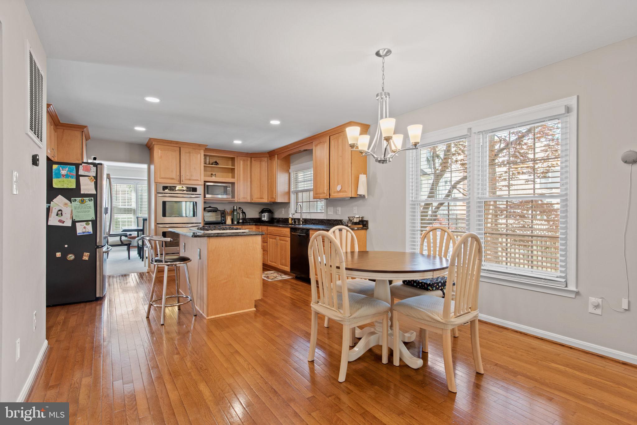8104 Creekview Drive Springfield, VA 22153 - Photo 11 of 39 a dining room with furniture and wooden floor
