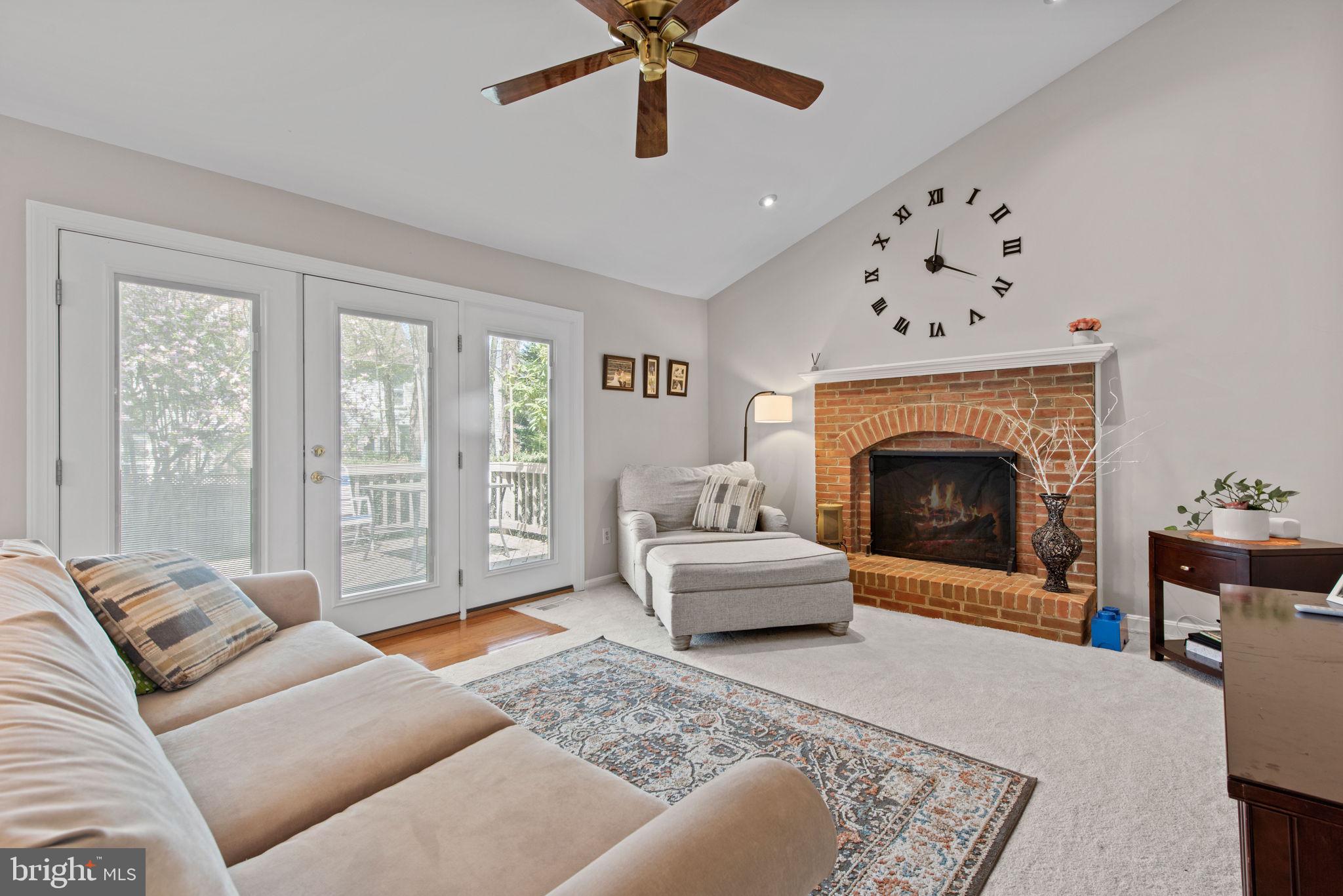 8104 Creekview Drive Springfield, VA 22153 - Photo 12 of 39 a living room with furniture and a fireplace