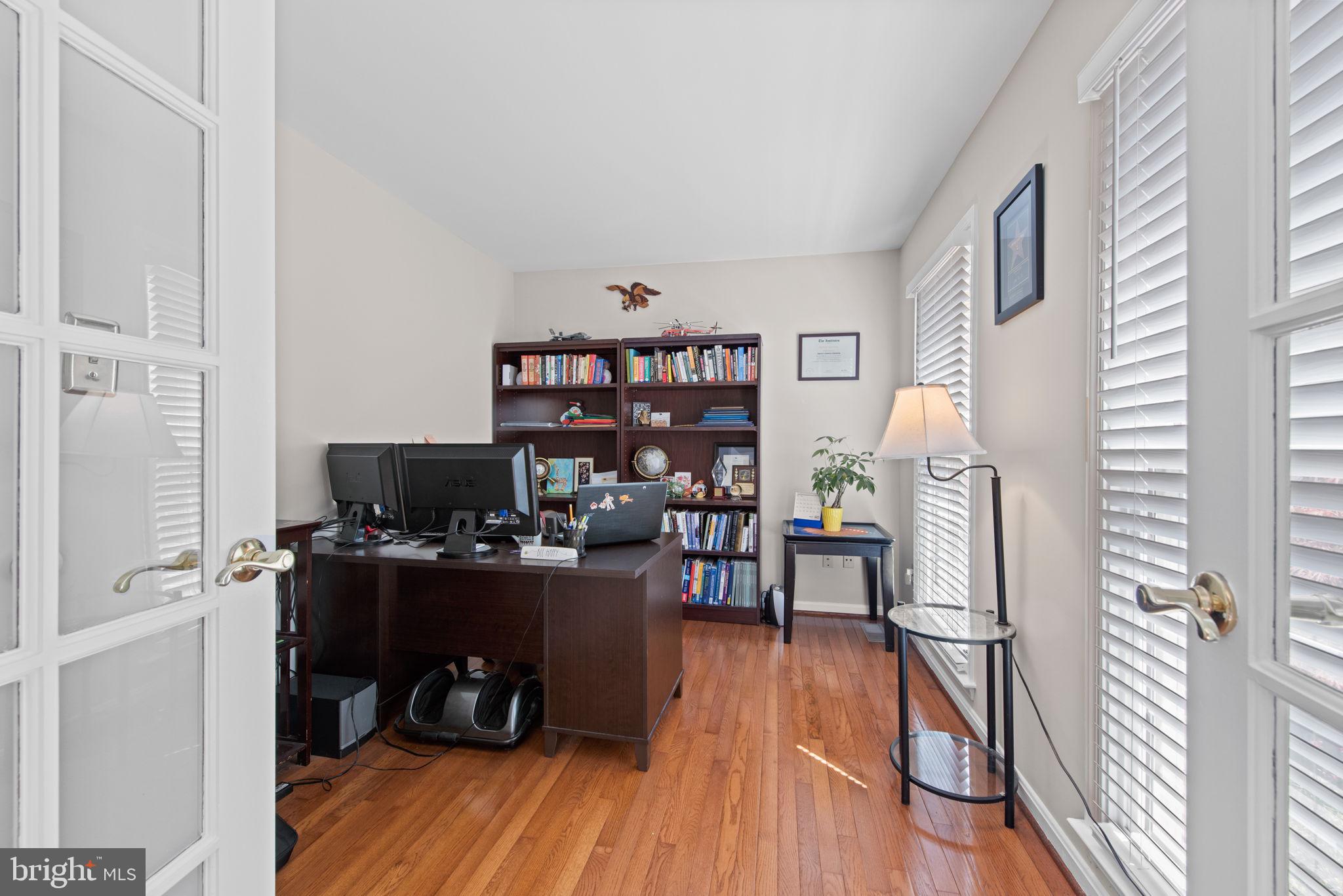 8104 Creekview Drive Springfield, VA 22153 - Photo 16 of 39 a view of a workspace with furniture and wooden floor