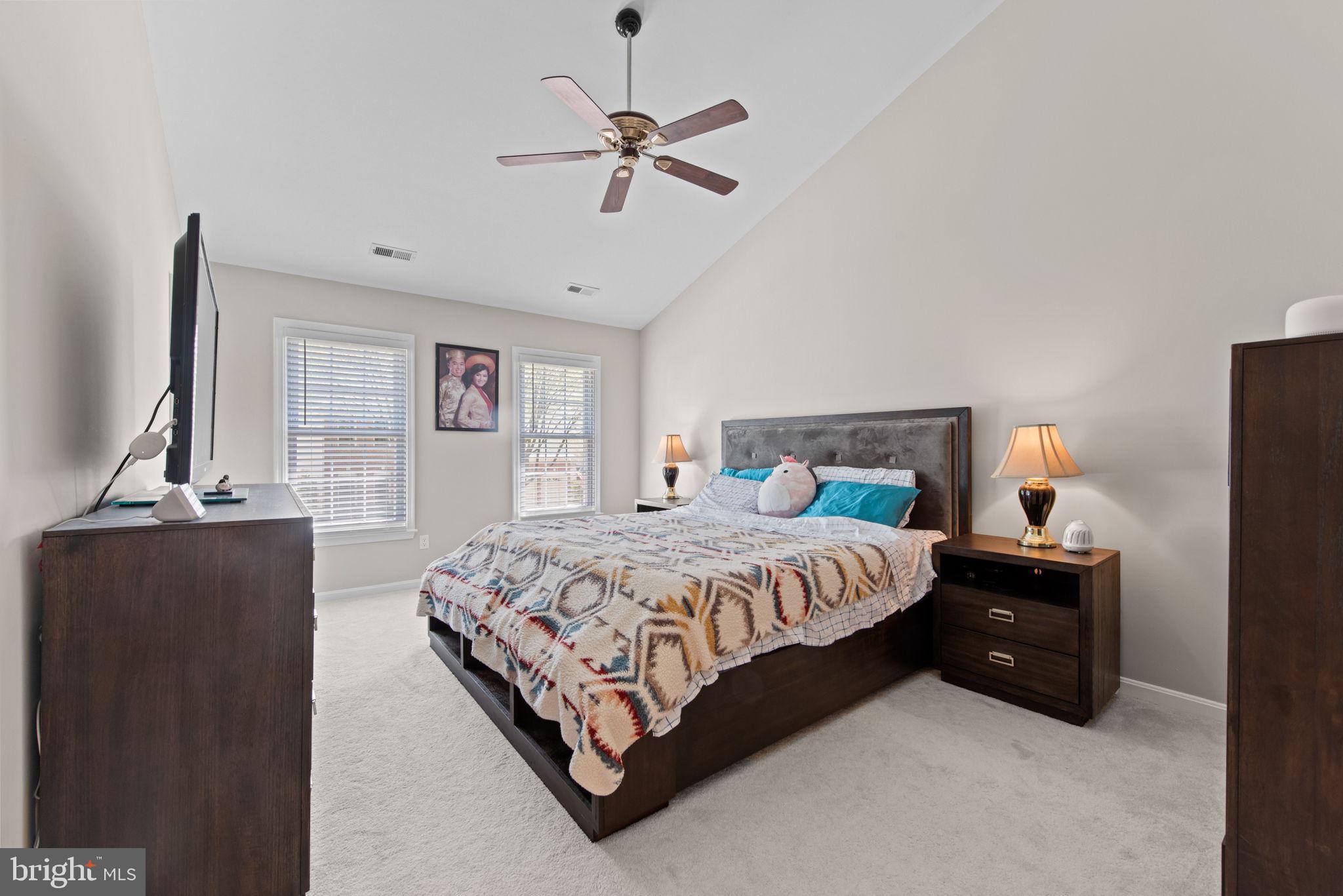 8104 Creekview Drive Springfield, VA 22153 - Photo 18 of 39 a bedroom with a bed and wooden floor