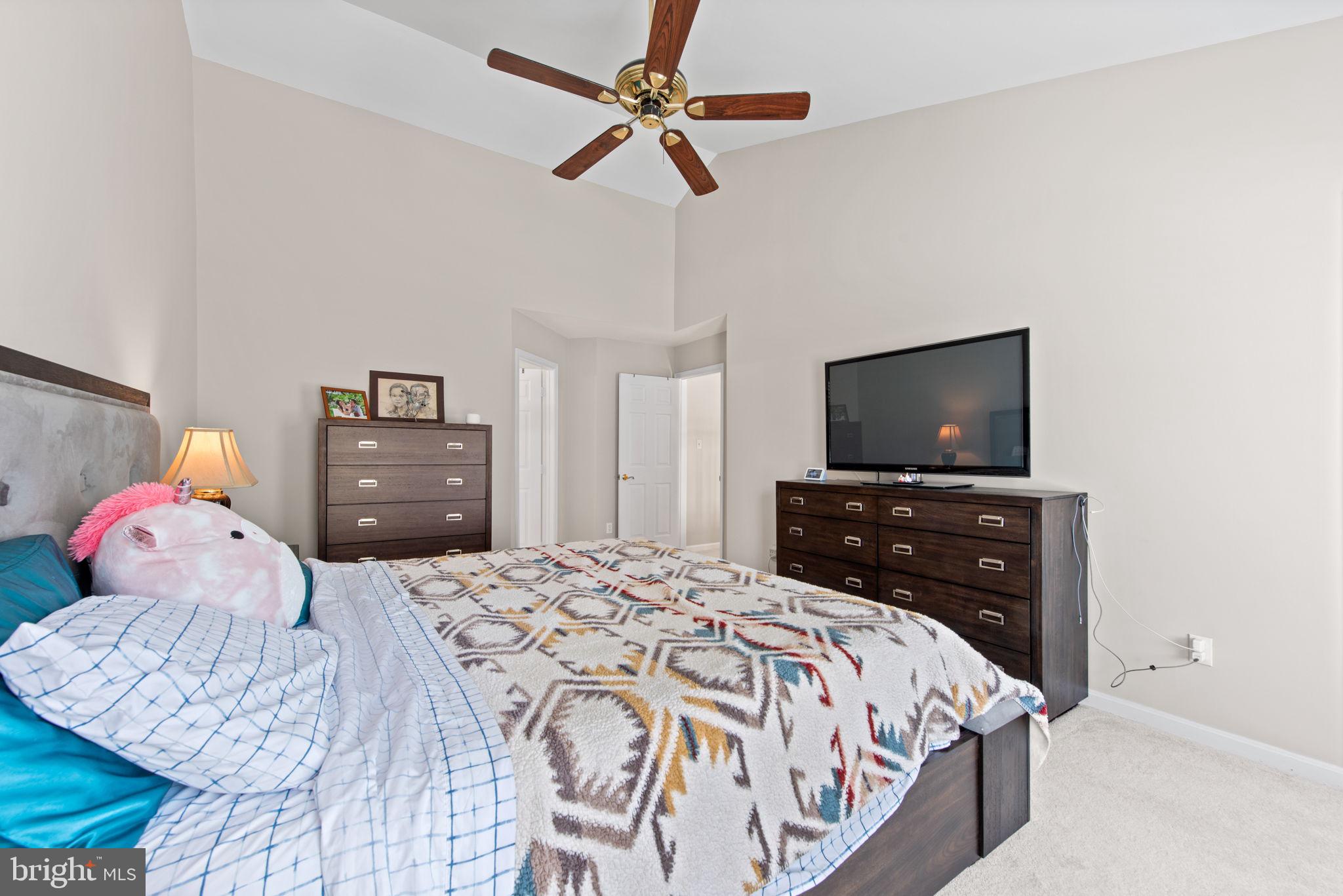 8104 Creekview Drive Springfield, VA 22153 - Photo 19 of 39 a bedroom with a bed and a flat screen tv