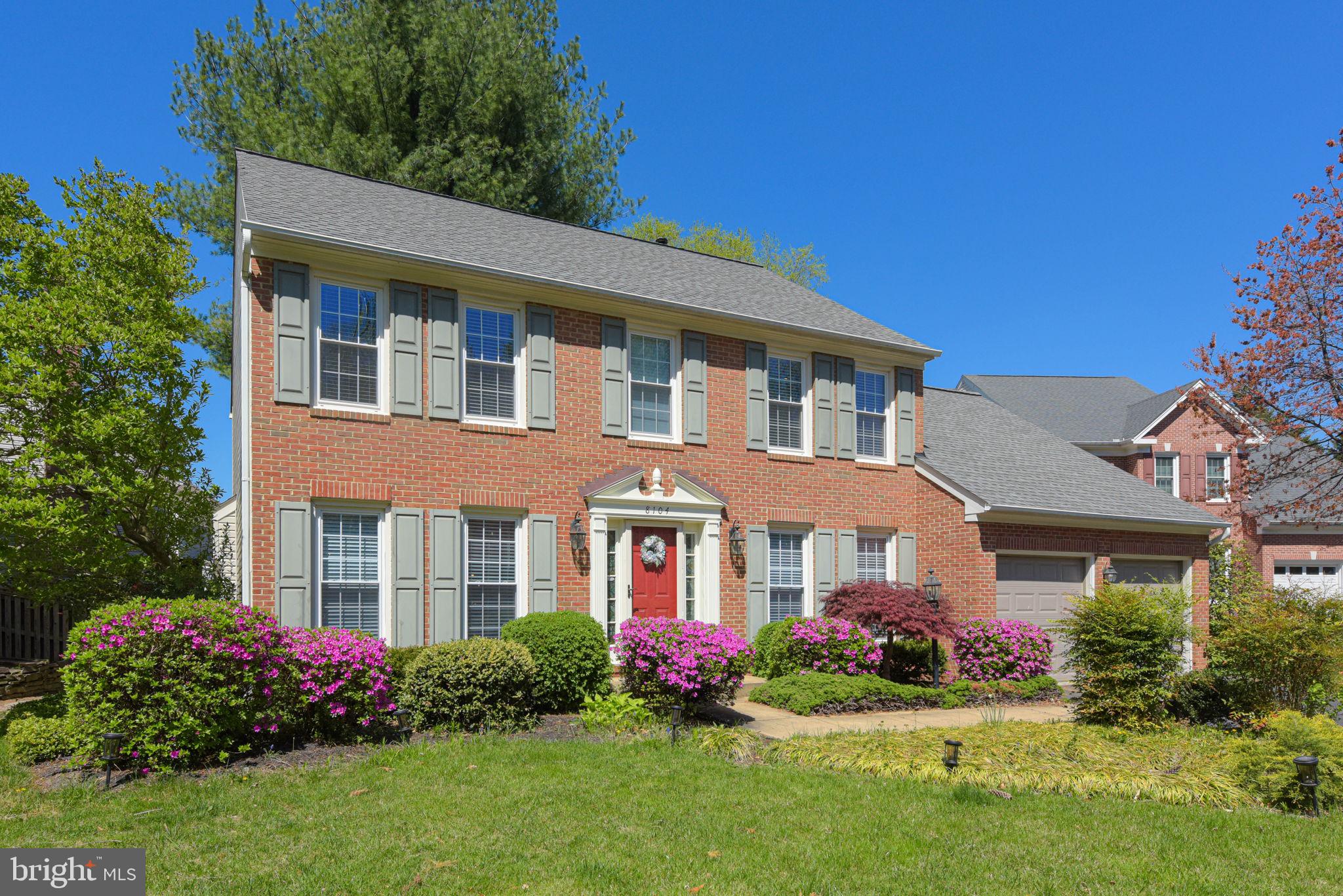 8104 Creekview Drive Springfield, VA 22153 - Photo 2 of 39 a front view of a house with garden and porch
