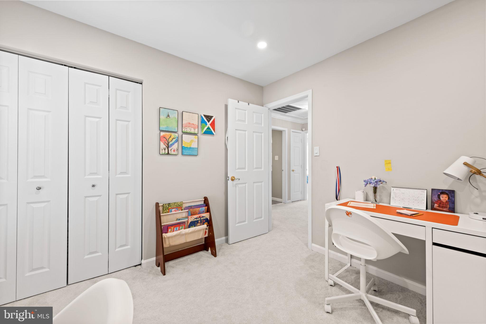 8104 Creekview Drive Springfield, VA 22153 - Photo 24 of 39 a bedroom with furniture and a book shelf