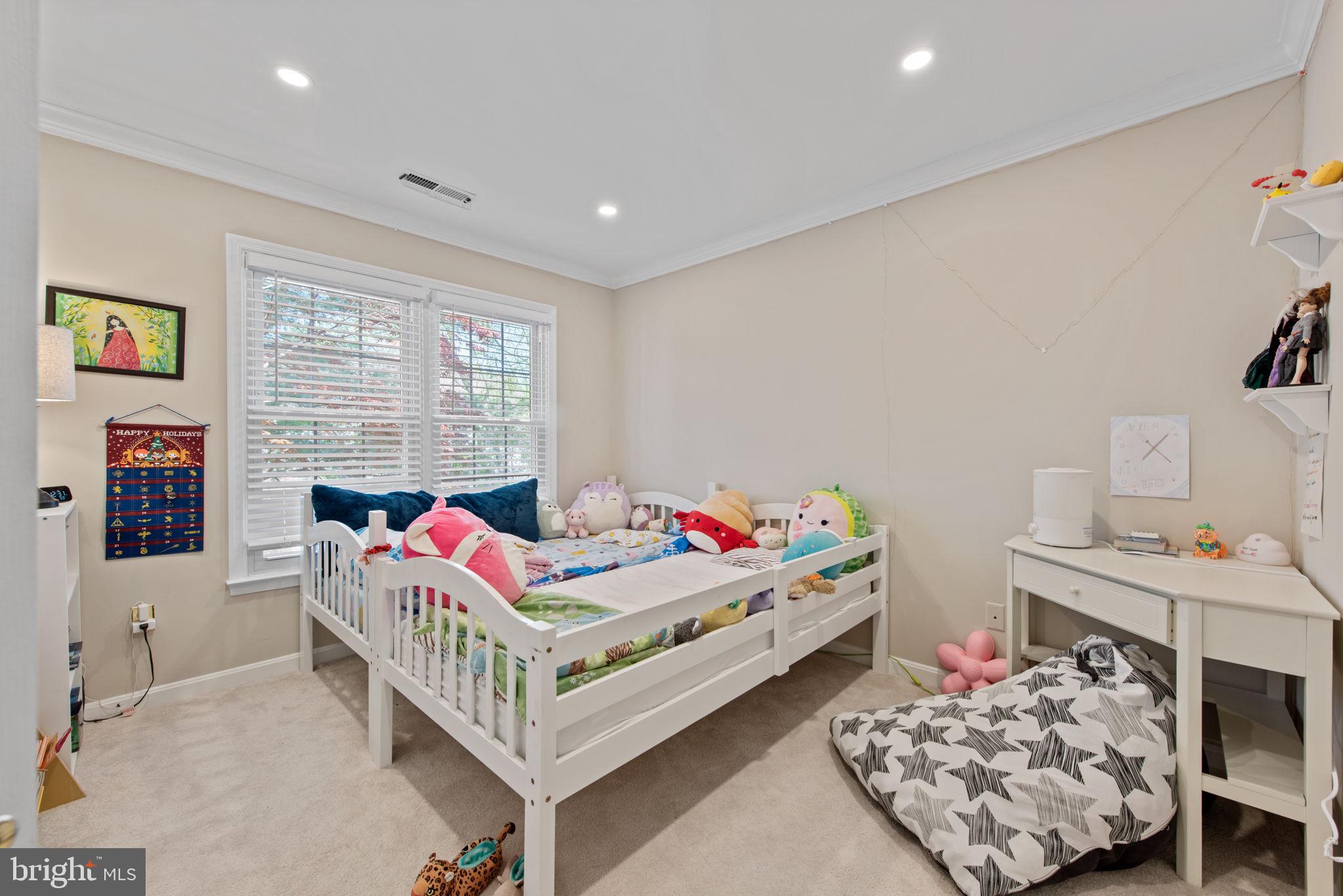 8104 Creekview Drive Springfield, VA 22153 - Photo 25 of 39 a bedroom with a bed and a window