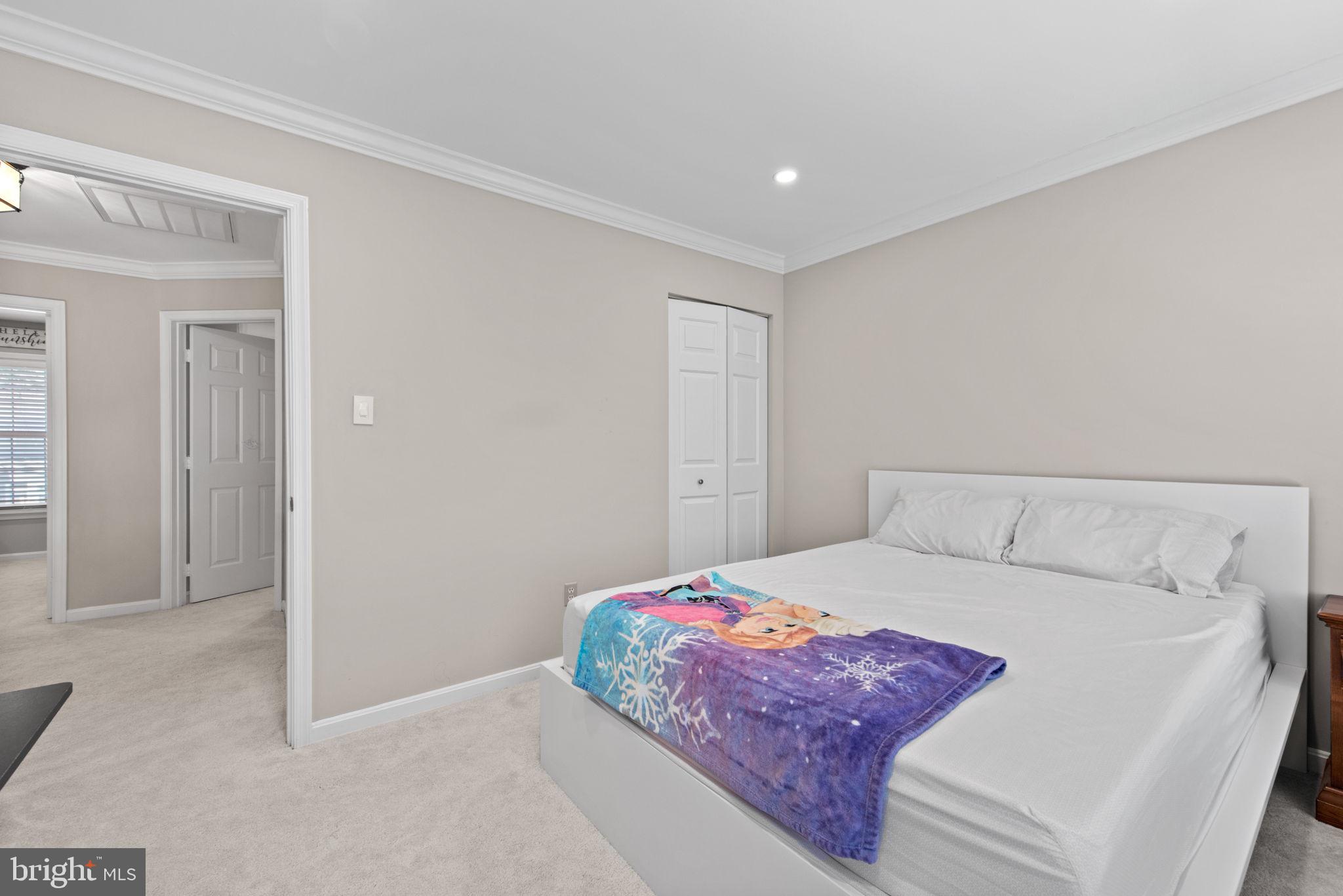 8104 Creekview Drive Springfield, VA 22153 - Photo 30 of 39 a bedroom with a bed and a cabinets