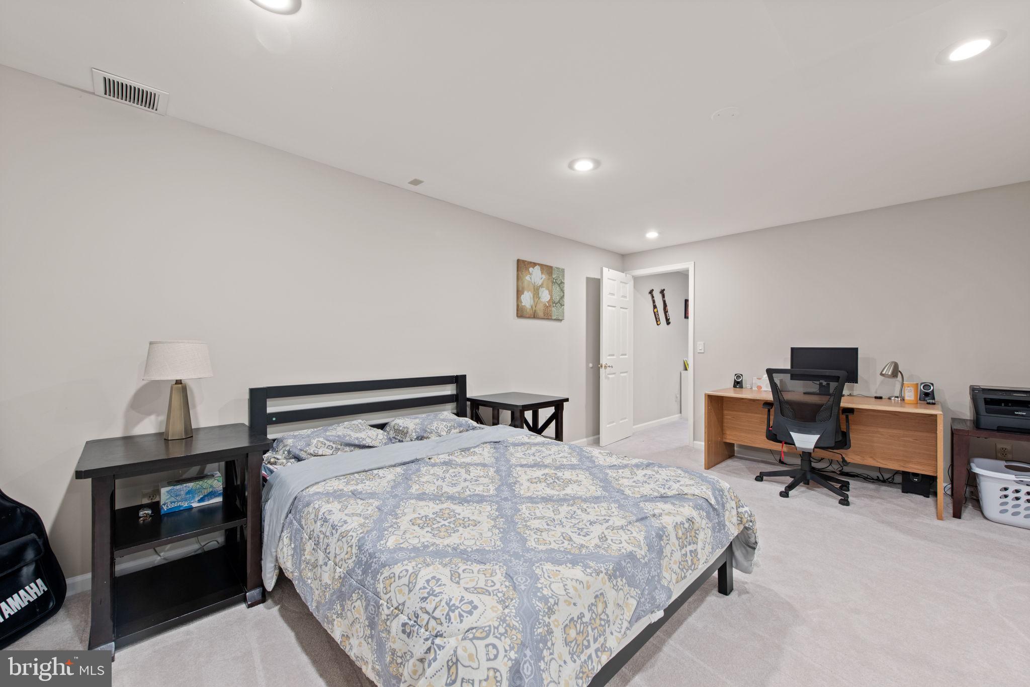 8104 Creekview Drive Springfield, VA 22153 - Photo 32 of 39 a bedroom with a bed and a desk