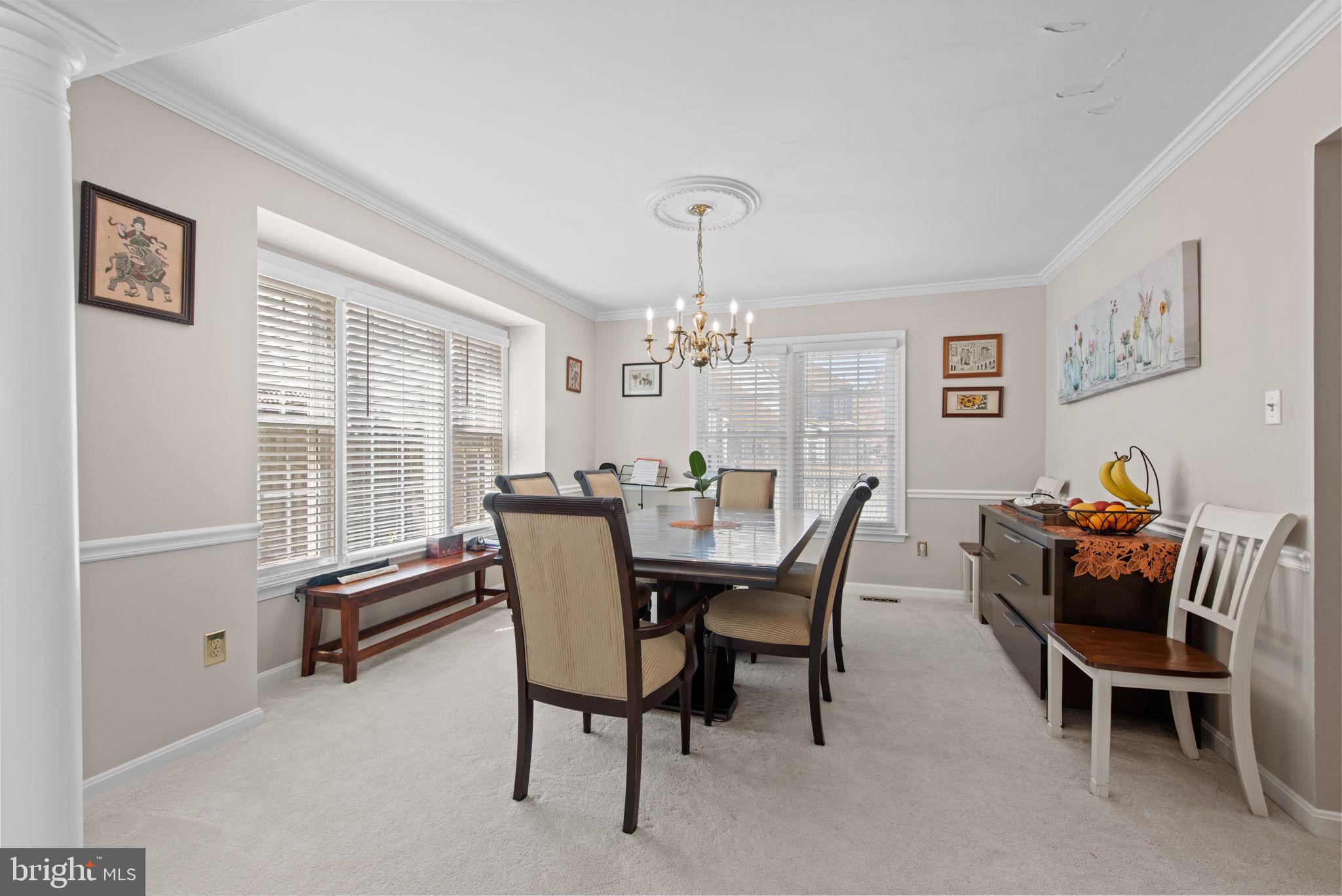 8104 Creekview Drive Springfield, VA 22153 - Photo 6 of 39 a view of a dining room with furniture and chandelier