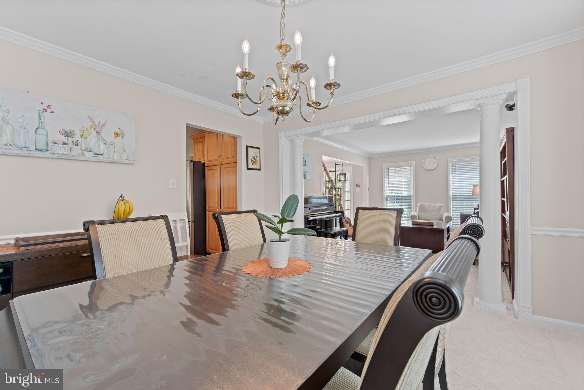 8104 Creekview Drive Springfield, VA 22153 - Photo 7 of 39 a view of a dining room with furniture and wooden floor