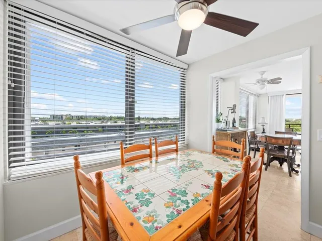 a kitchen with stainless steel appliances kitchen island granite countertop a refrigerator and microwave