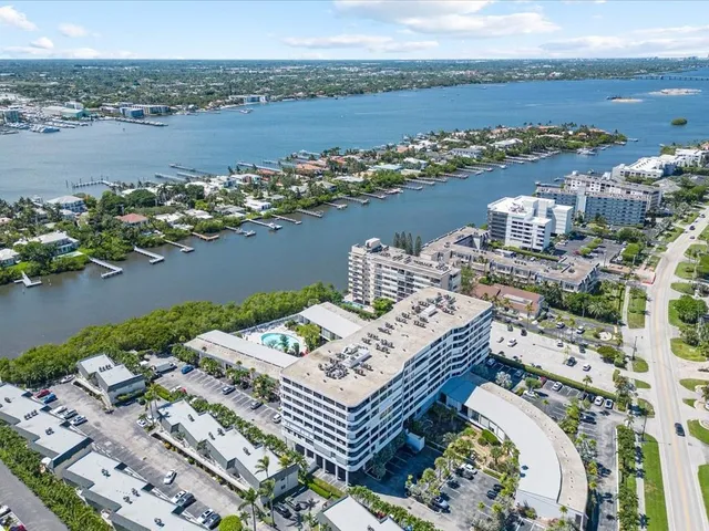 an aerial view of a house with a lake view