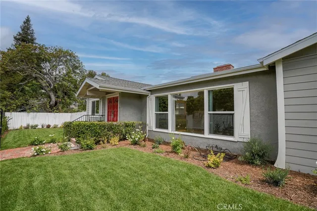 front view of a house with a yard