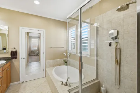 a bathroom with a bathtub and a shower